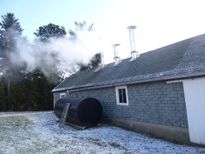 Steam rising from Monroe's Orchard Sugarhouse.